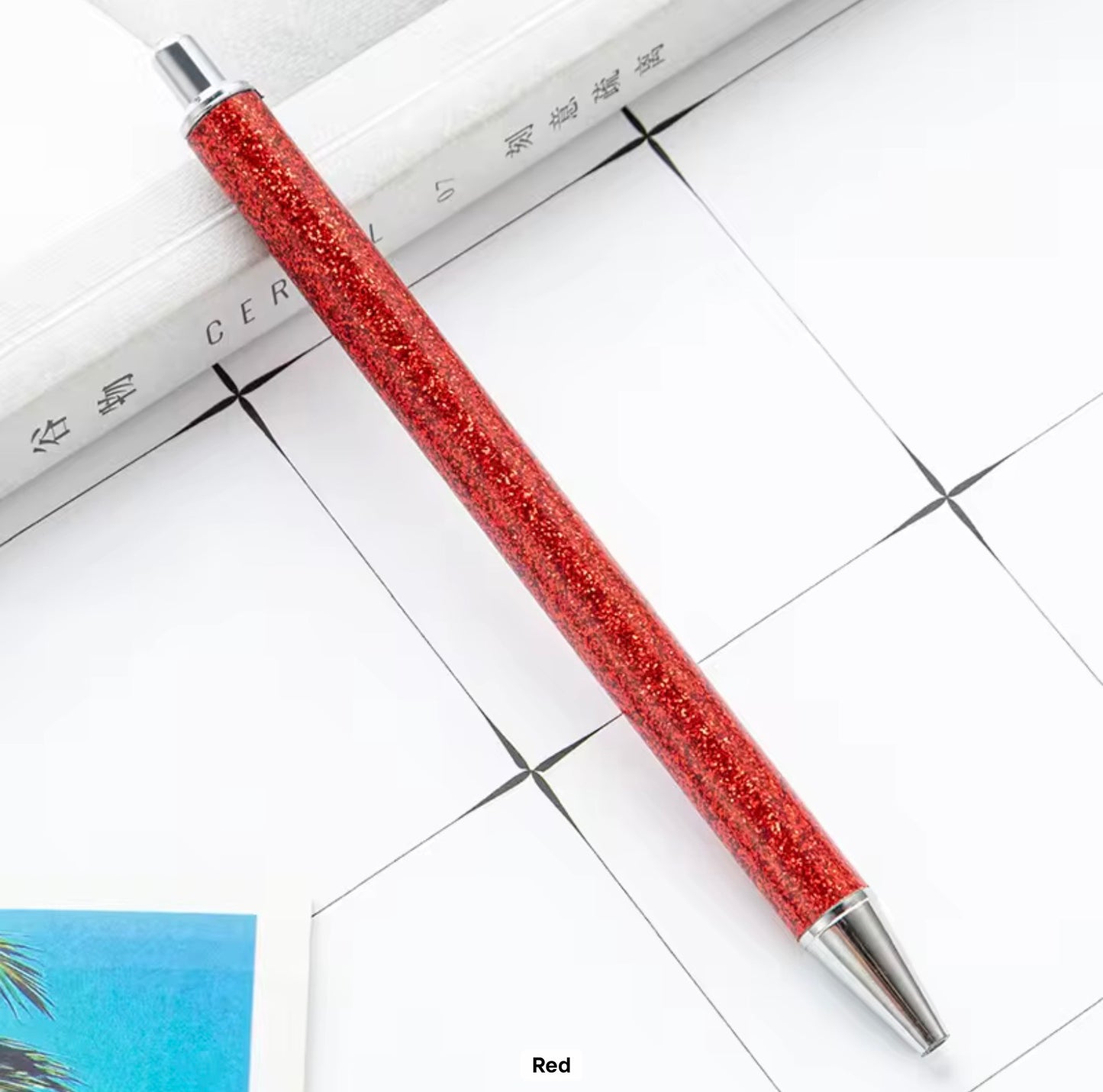 Glitter metal retractable ballpoint pen.