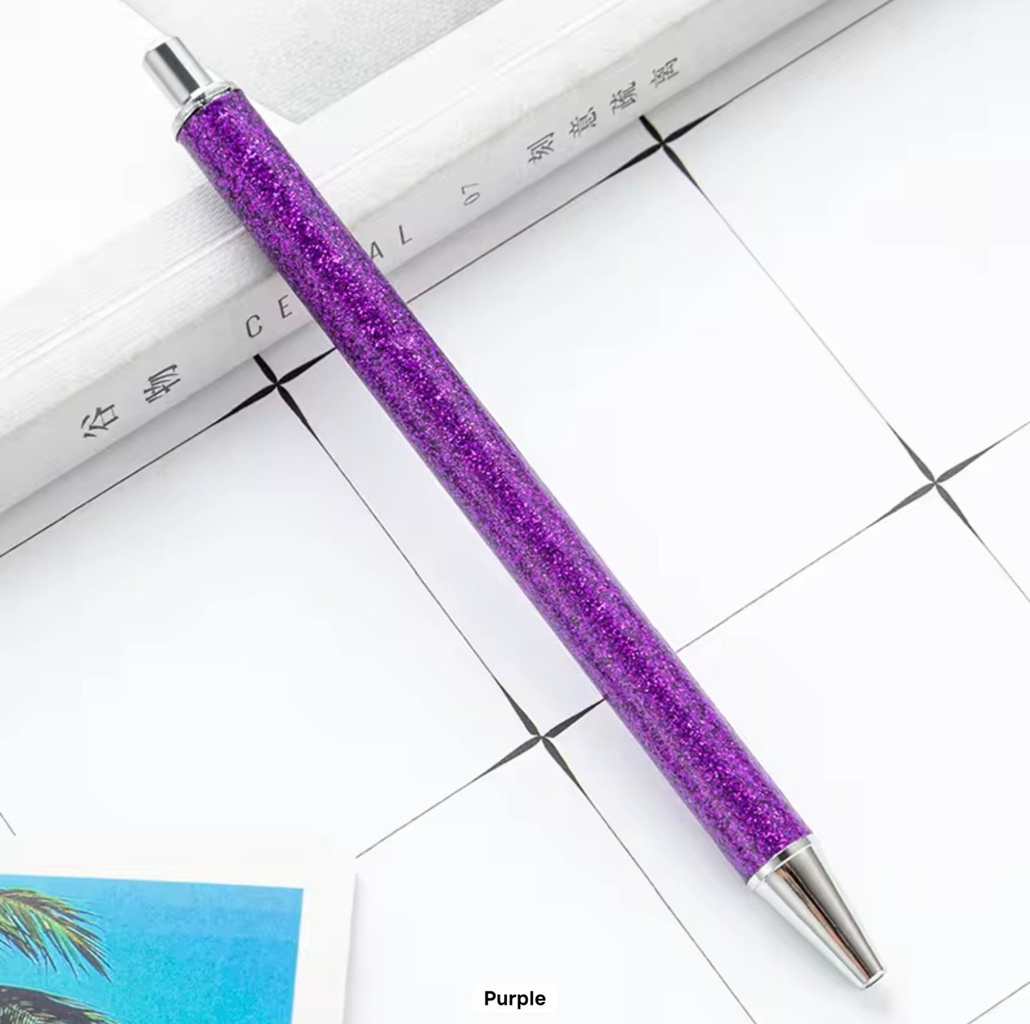 Glitter metal retractable ballpoint pen.