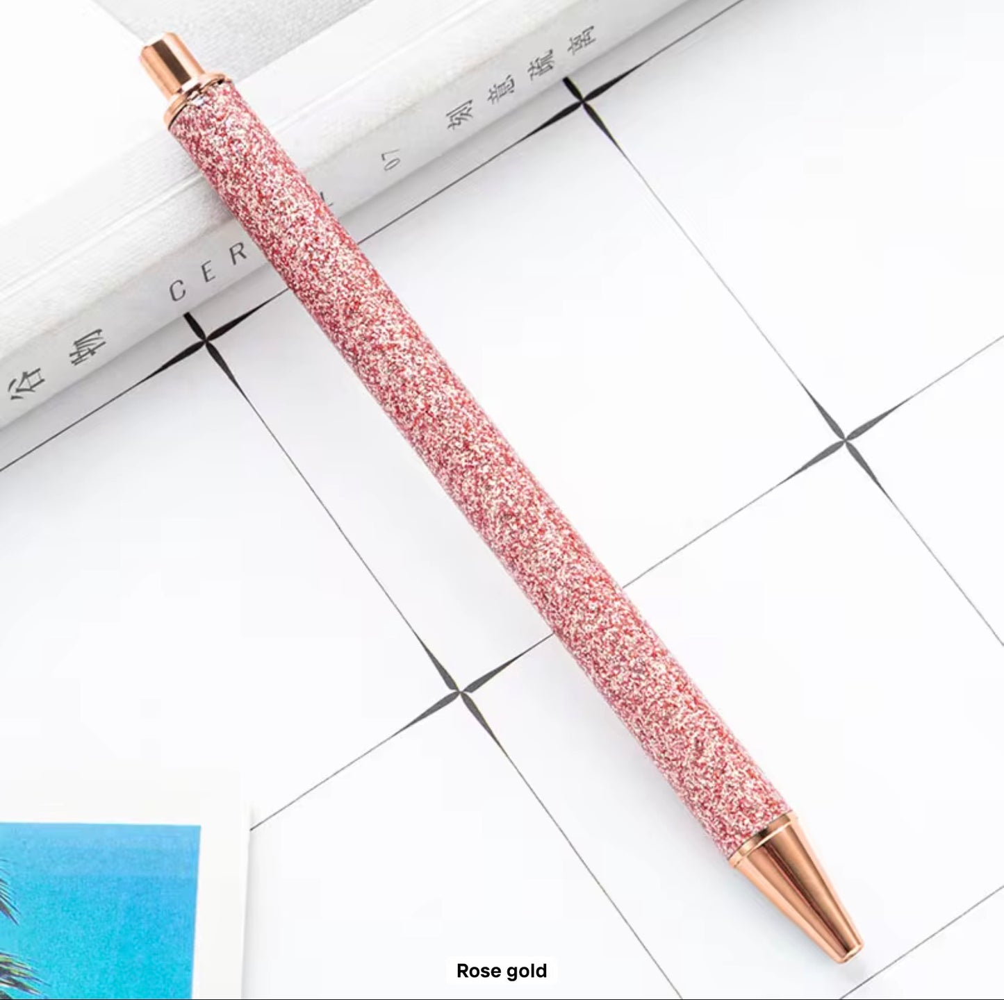 Glitter metal retractable ballpoint pen.