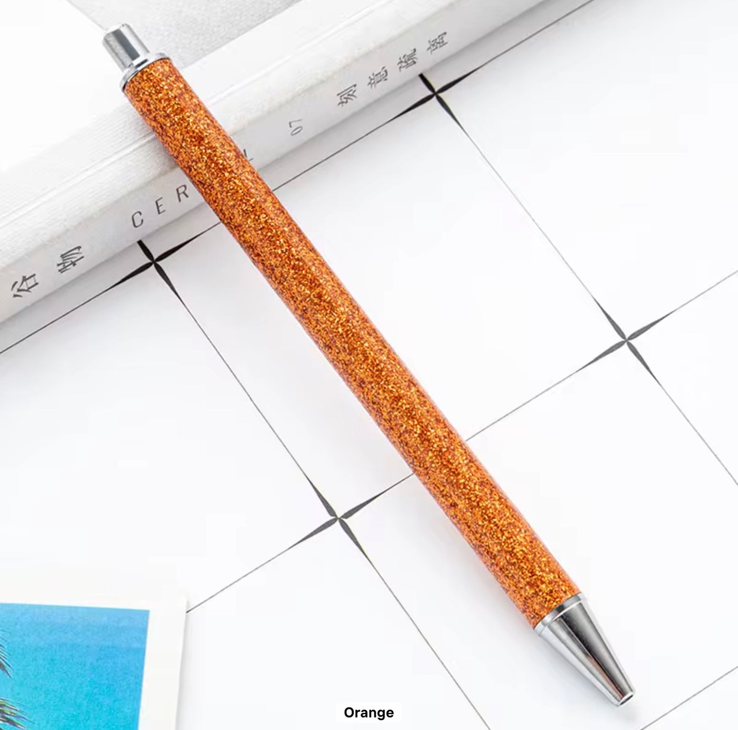 Glitter metal retractable ballpoint pen.