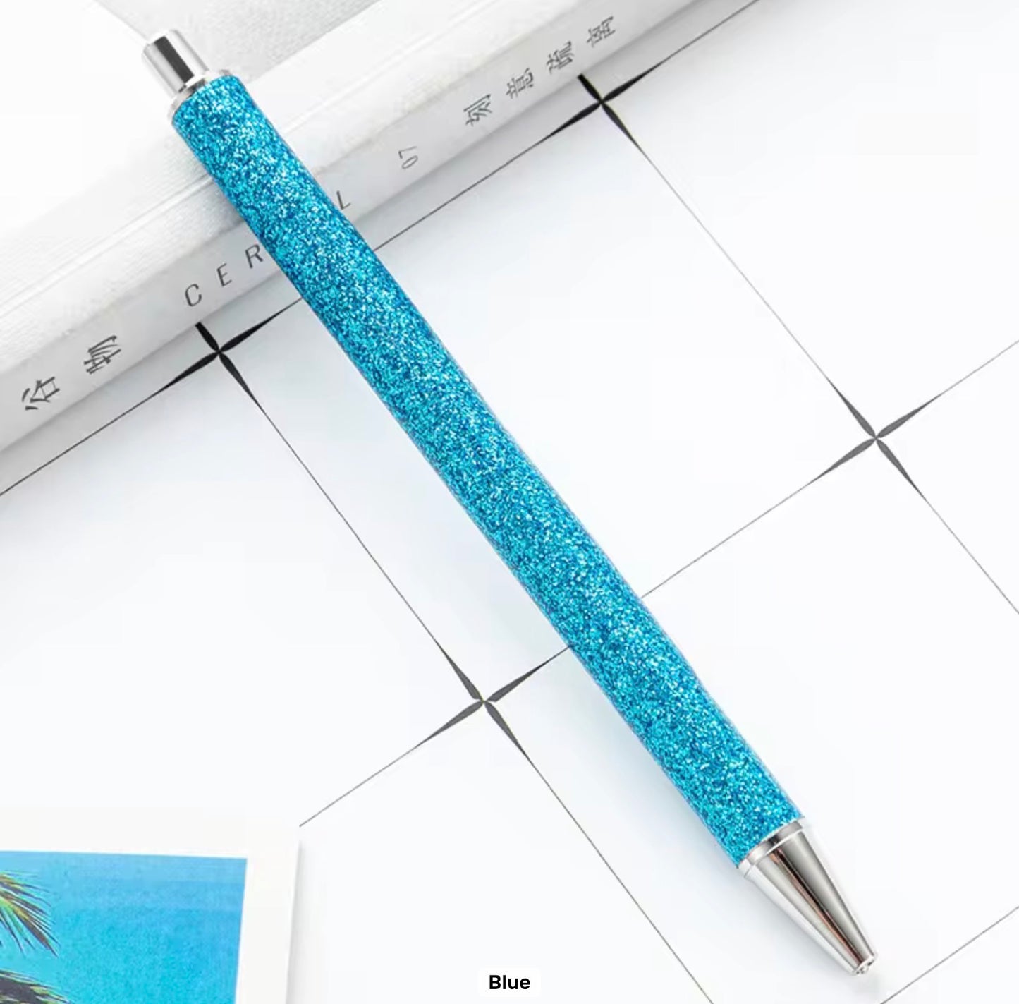 Glitter metal retractable ballpoint pen.