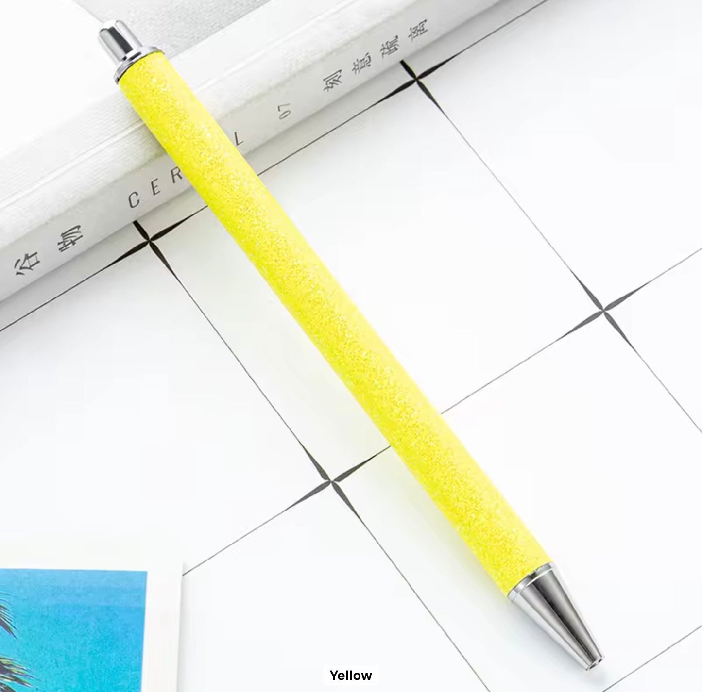 Glitter metal retractable ballpoint pen.