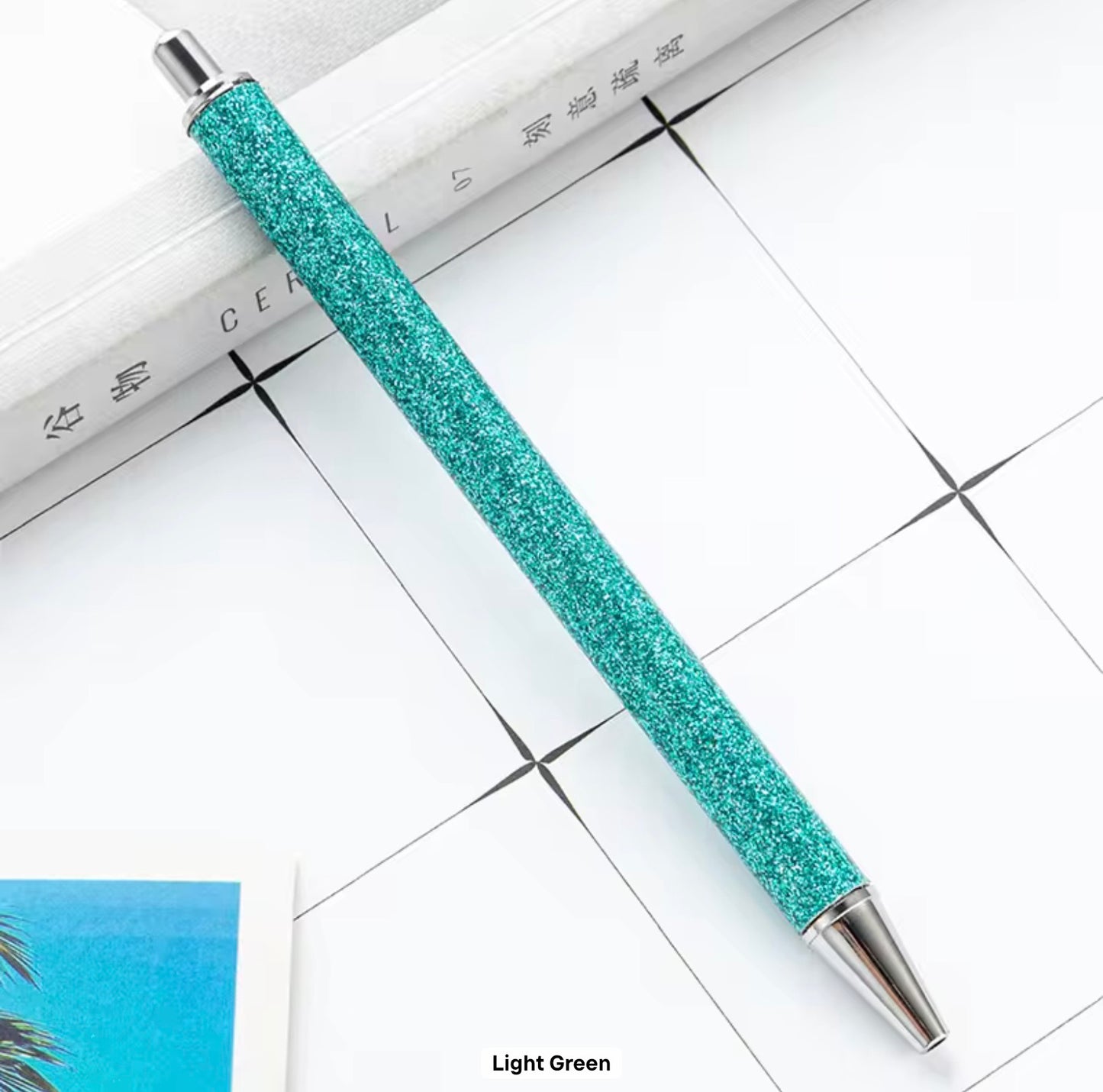 Glitter metal retractable ballpoint pen.