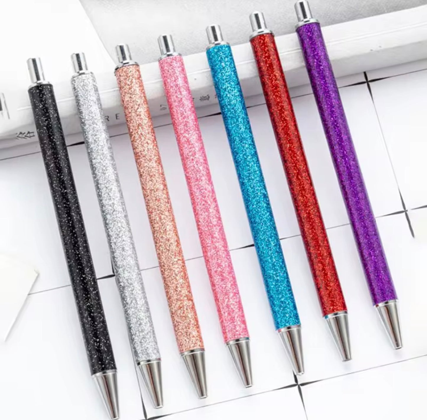 Glitter metal retractable ballpoint pen.