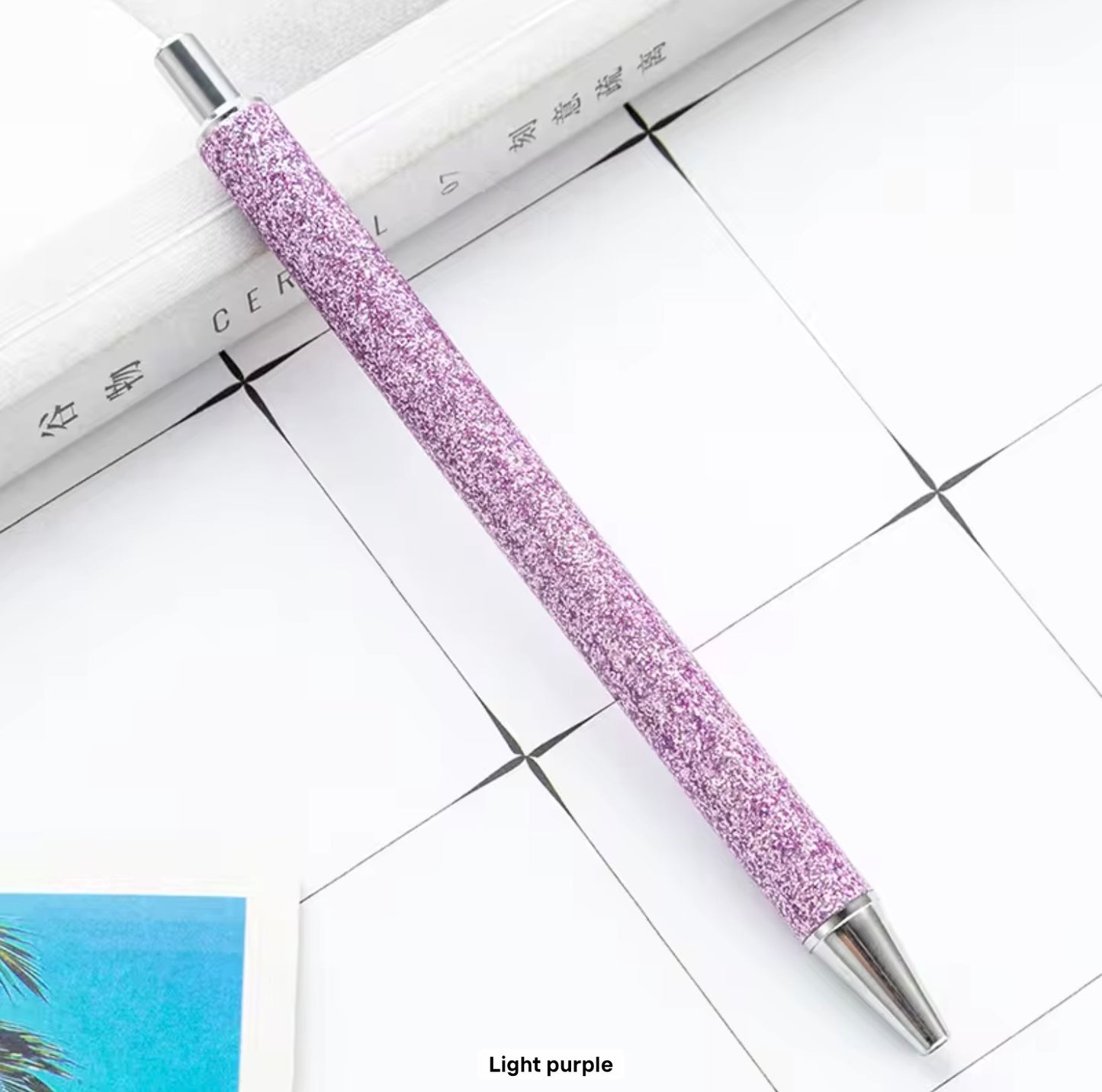 Glitter metal retractable ballpoint pen.