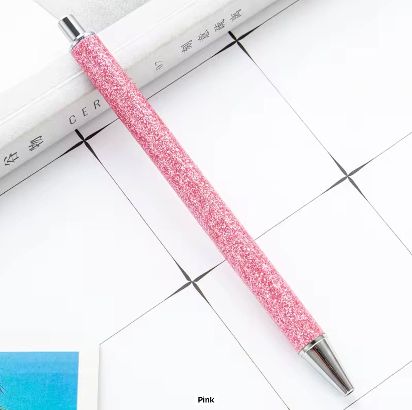Glitter metal retractable ballpoint pen.