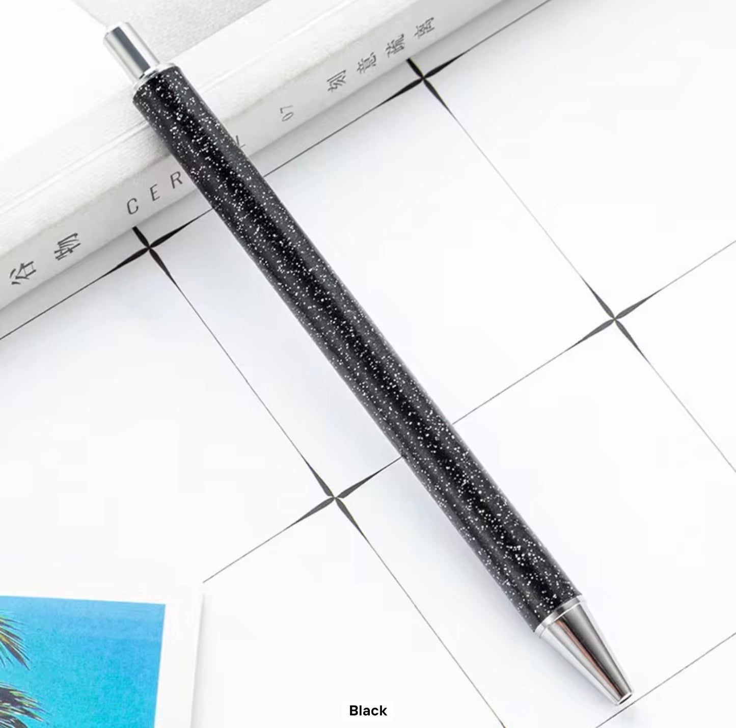 Glitter metal retractable ballpoint pen.
