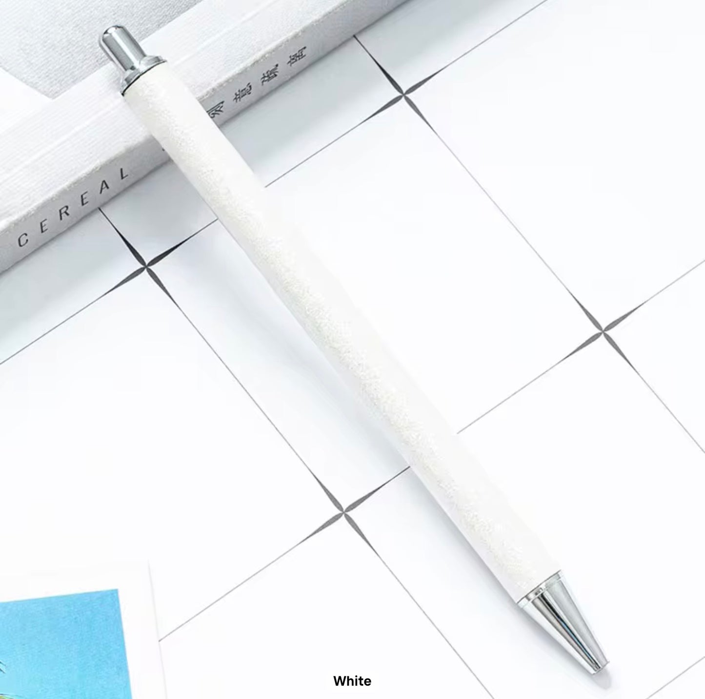 Glitter metal retractable ballpoint pen.