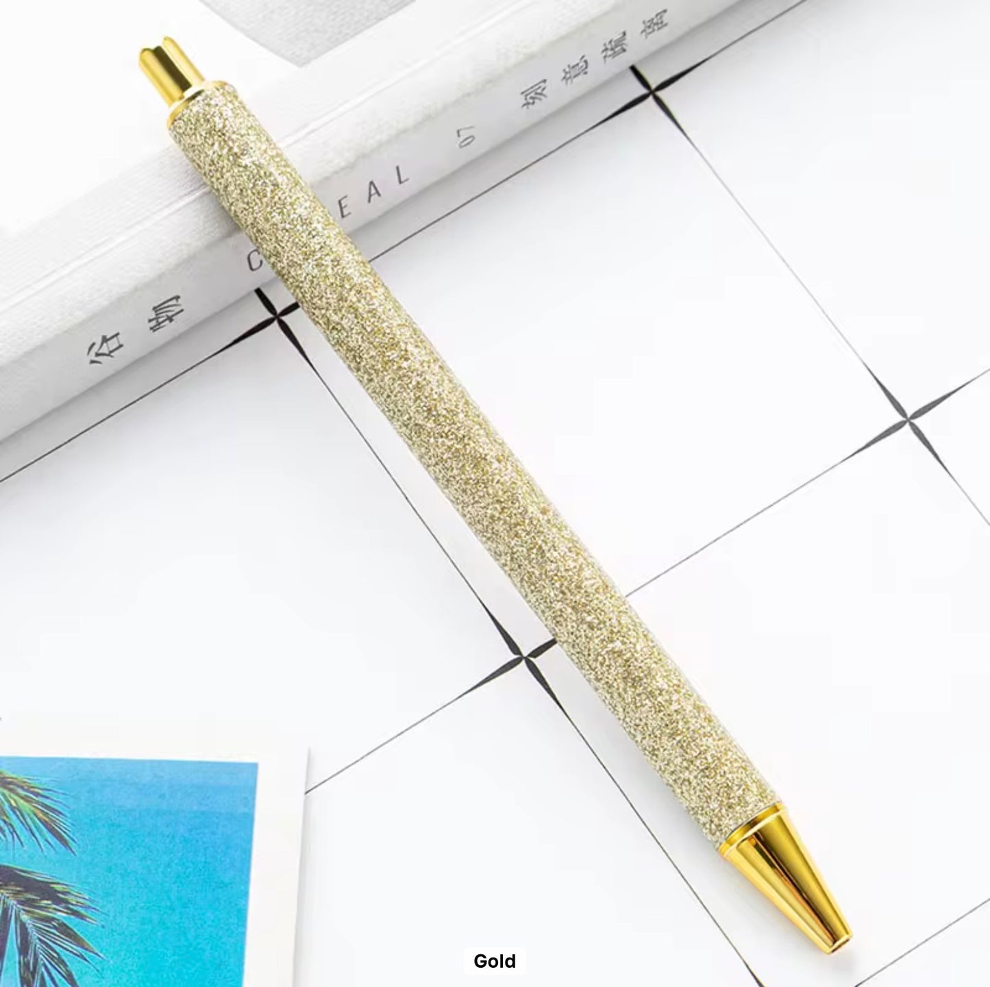 Glitter metal retractable ballpoint pen.